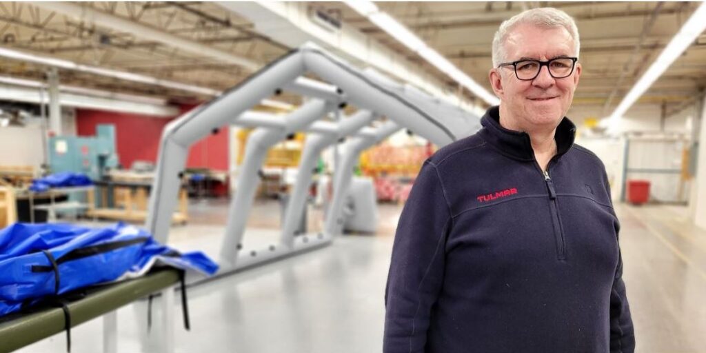 Patrick Tallon, Tulmar president, behind a new inflatable shelters undergoing testing.