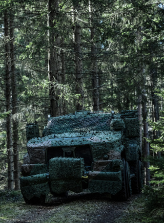 Military ground vehicle in a forest